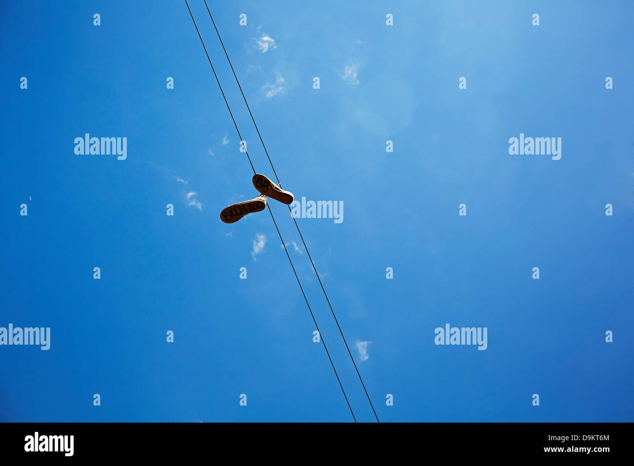 Pair of shoes caught on telephone line Stock Photo Alamy