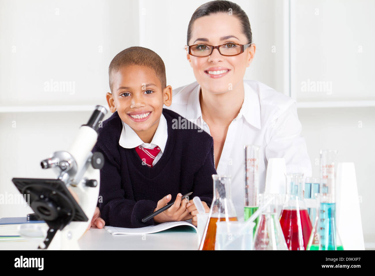 elementary science teacher and student in lab Stock Photo Alamy