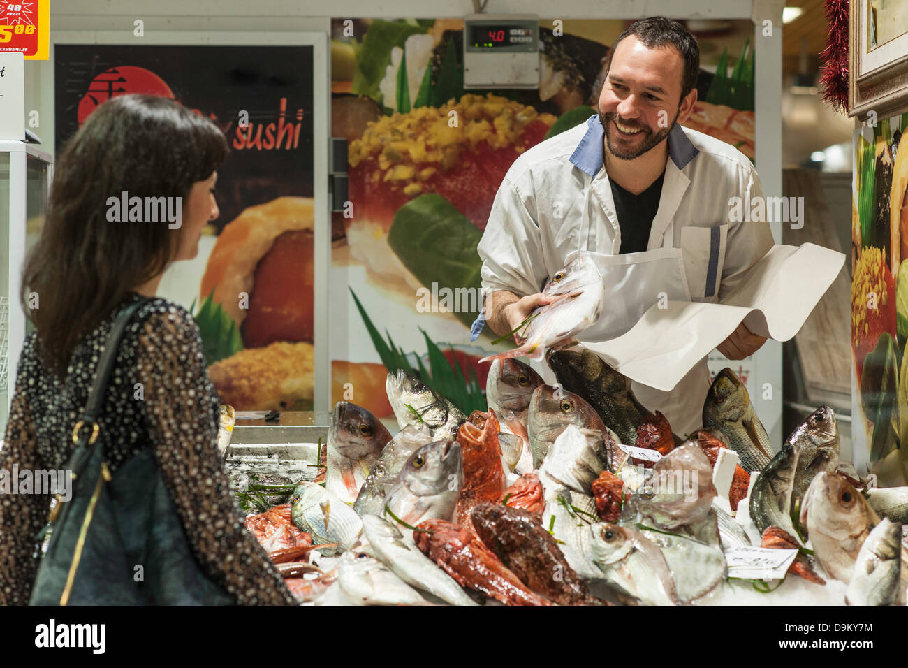 Woman buying fresh fish fishmonger Stock Photo