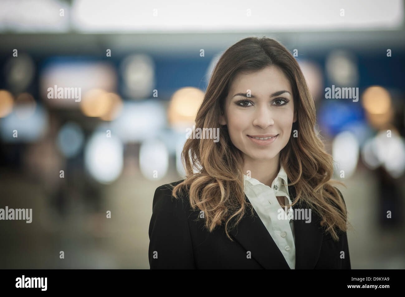 Portrait of young woman with long brown hair Stock Photo - Alamy