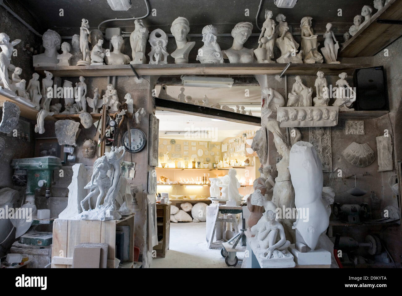 Large group of art and sculpture in artist's studio Stock Photo
