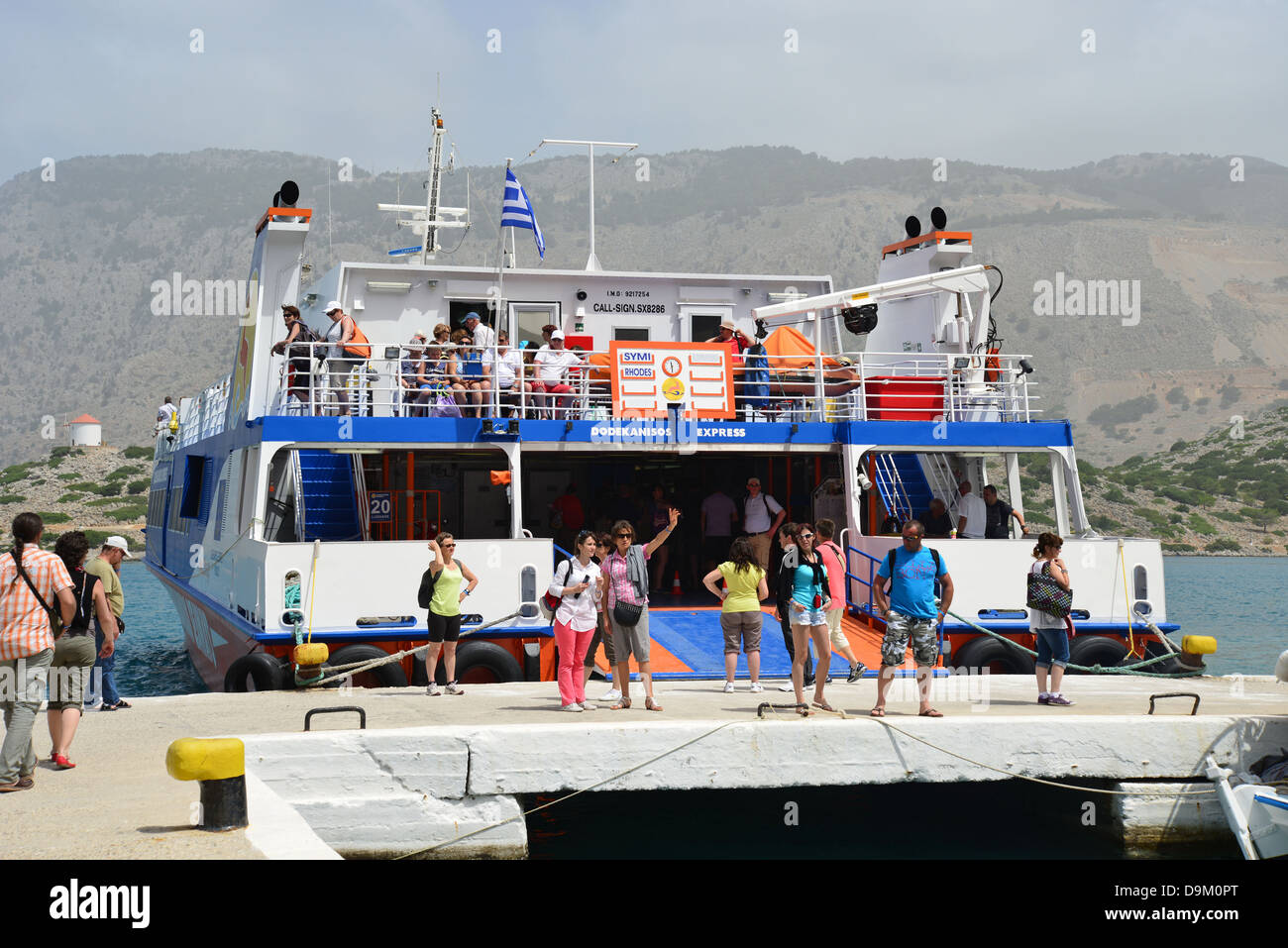 Ferry port at The Monastery of St Michael at Panormitis, Symi (Simi), Rhodes (Rodos) Region, Dodecanese, South Aegean, Greece Stock Photo