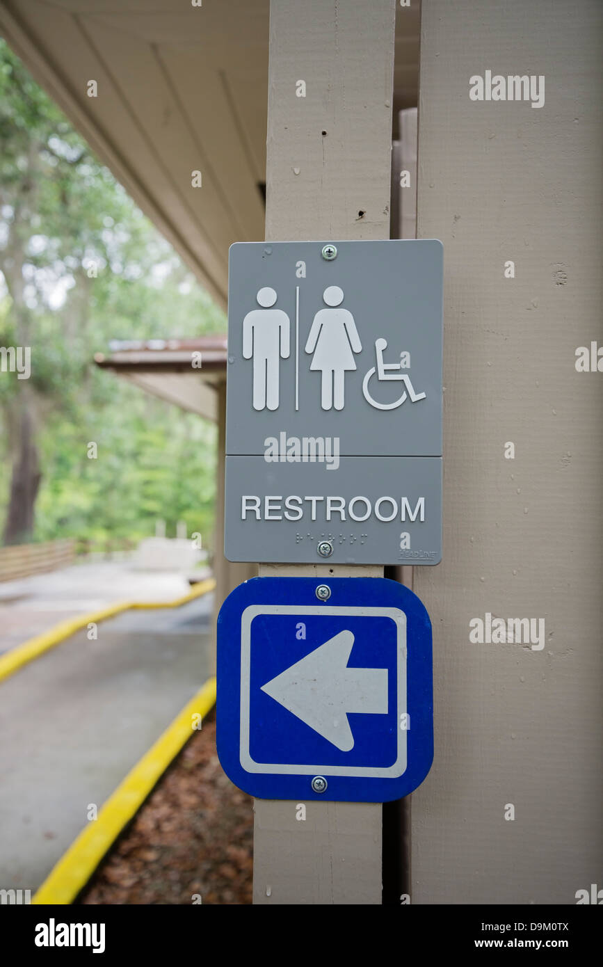 Sign for restrooms at a Florida State Park. Stock Photo