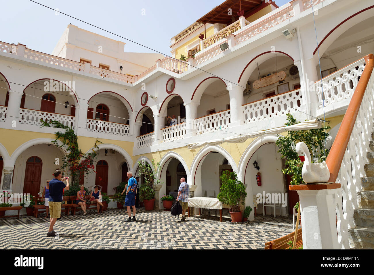 Courtyard of The Monastery of St Michael at Panormitis, Symi (Simi), Rhodes (Rodos) Region, The Dodecanese, South Aegean, Greece Stock Photo