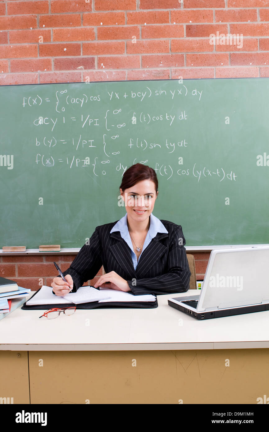 female school teacher in classroom Stock Photo - Alamy