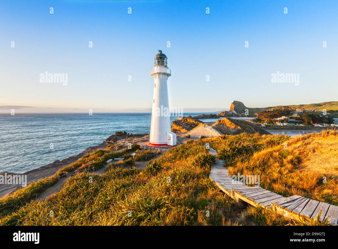 Castlepoint Lighthouse, Wairarapa, New Zealand, at sunrise. Stock Photo