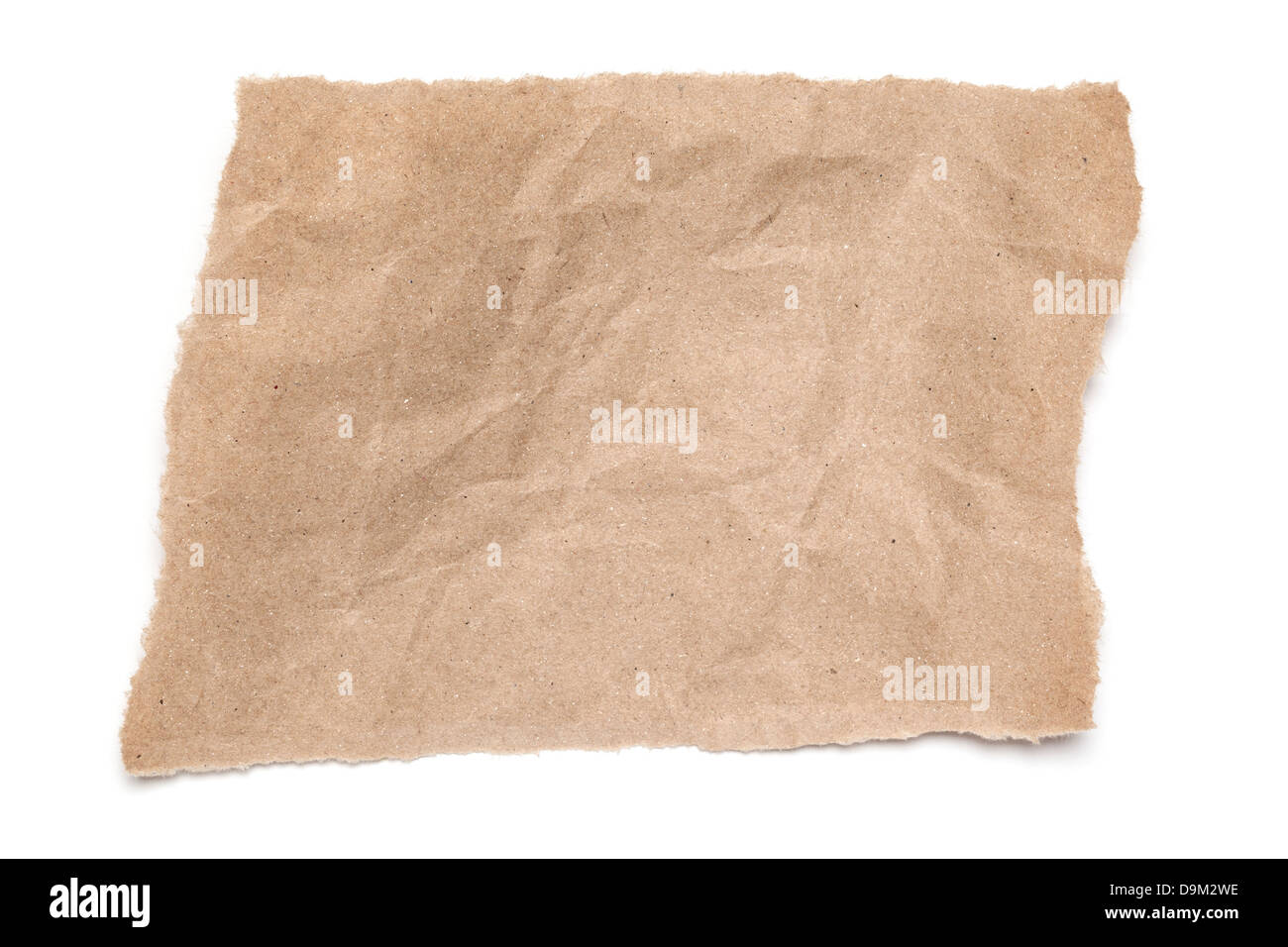 Torn and Creased Brown Paper - a ripped piece of crumpled brown paper, on white background with soft shadow. Stock Photo