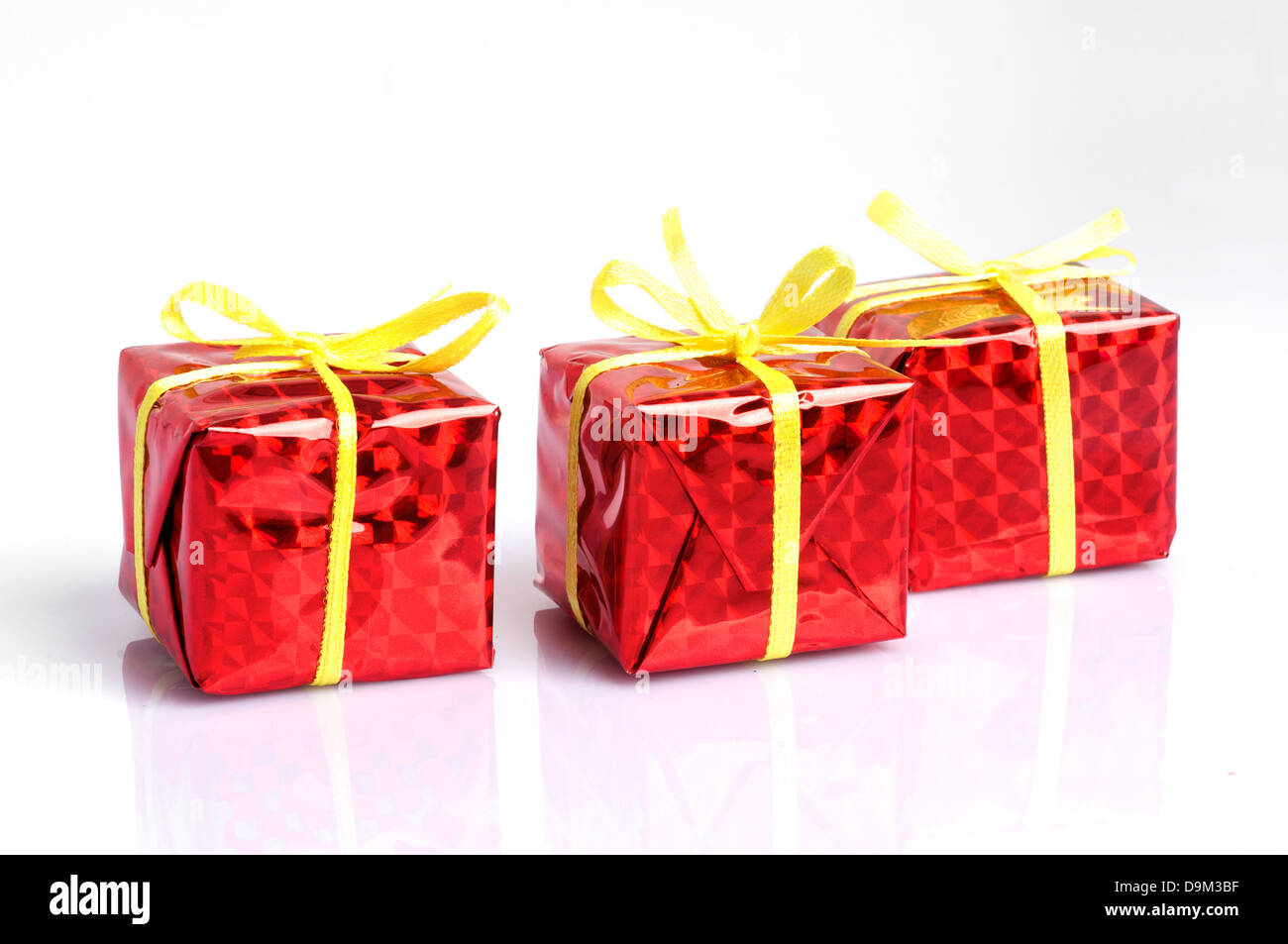 Red Gift boxes on white background Stock Photo - Alamy