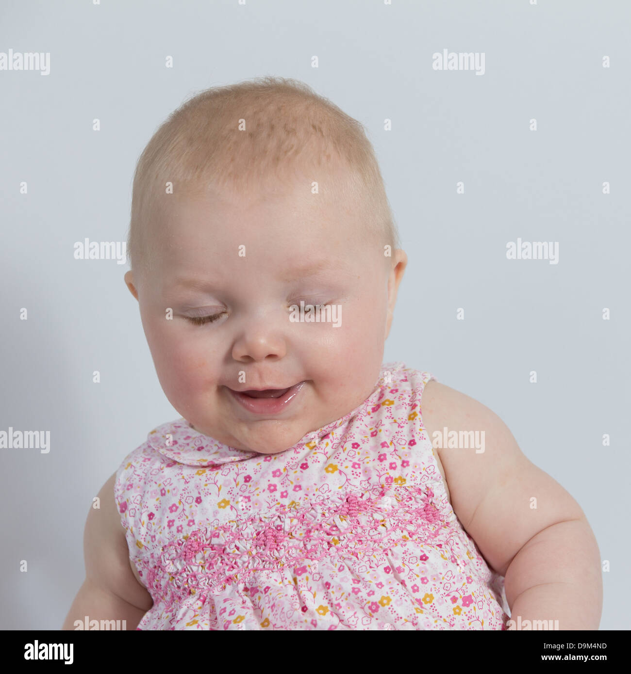 smiling baby with eyes closed Stock Photo Alamy