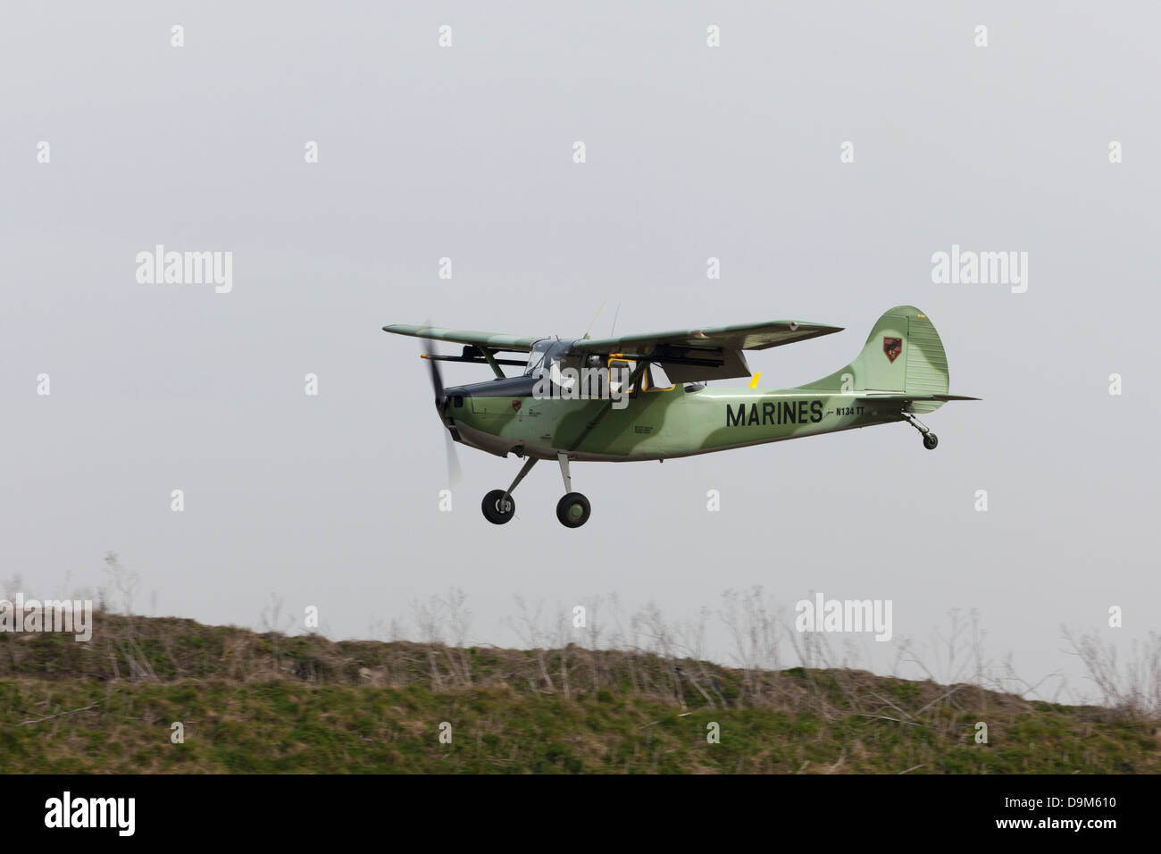Cessna O-1e Bird Dog N134TT in flight on final approach to land at Breighton Airfield Stock Photo