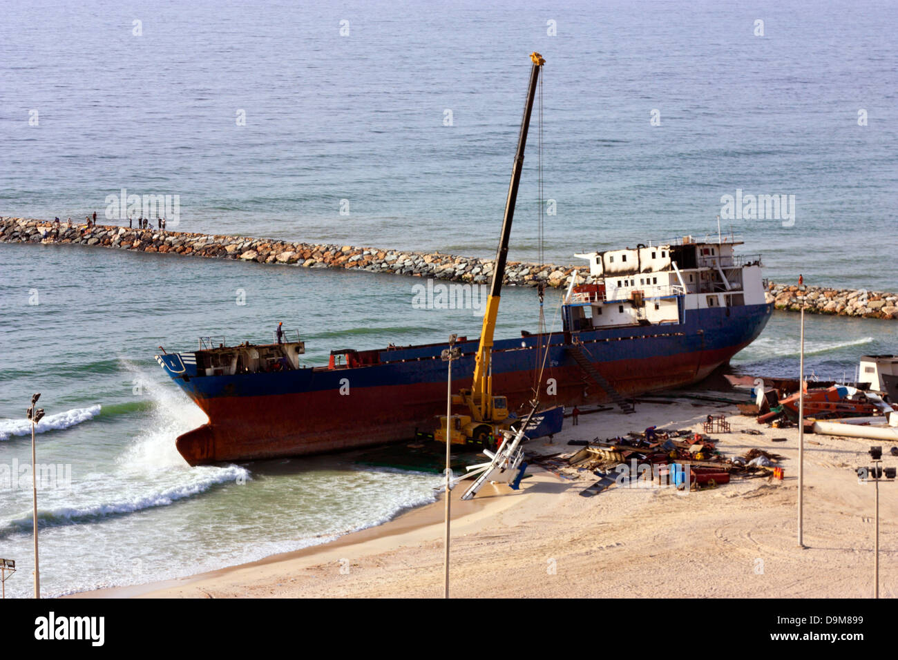 Ship breaking on the Beach, Coastal Freighter run aground in Ajman, United Arab Emirates Stock Photo