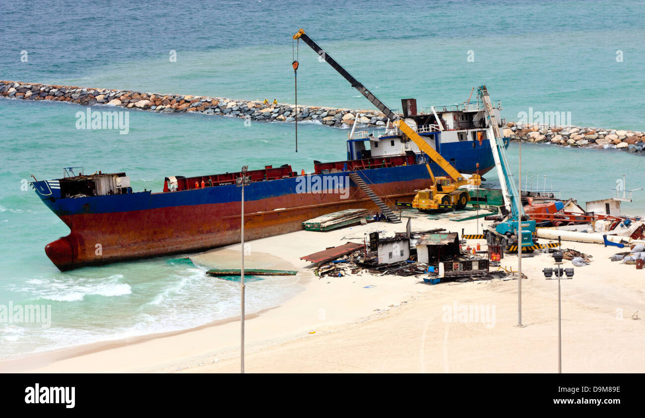 Ship breaking on the Beach, Coastal Freighter run aground in Ajman, United Arab Emirates Stock Photo