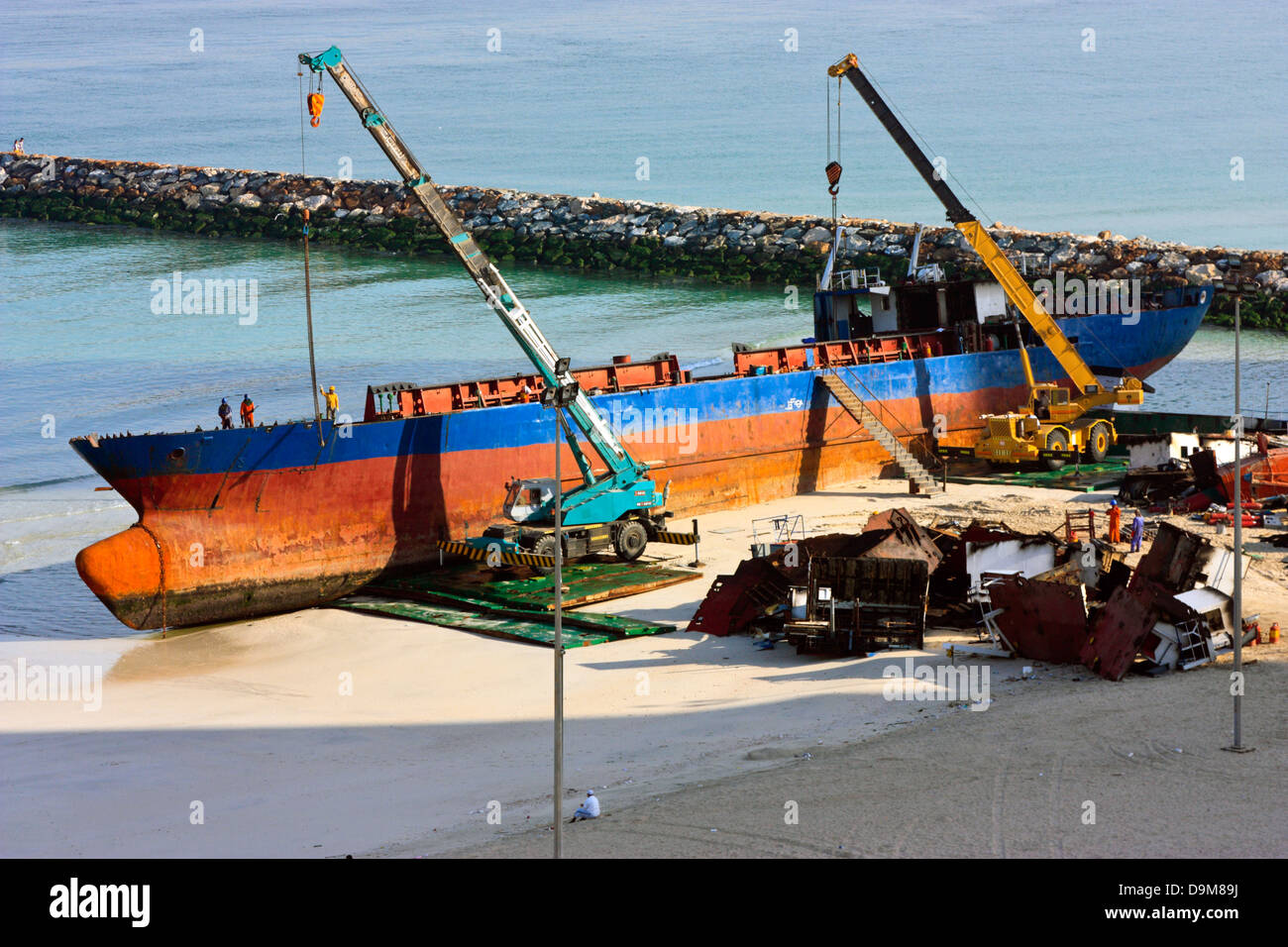 Ship breaking on the Beach, Coastal Freighter run aground in Ajman, United Arab Emirates Stock Photo