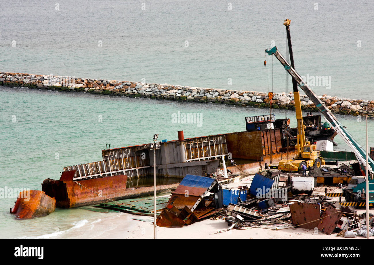 Ship breaking on the Beach, Coastal Freighter run aground in Ajman, United Arab Emirates Stock Photo