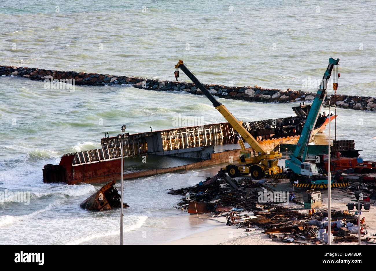 Ship breaking on the Beach, Coastal Freighter run aground in Ajman, United Arab Emirates Stock Photo