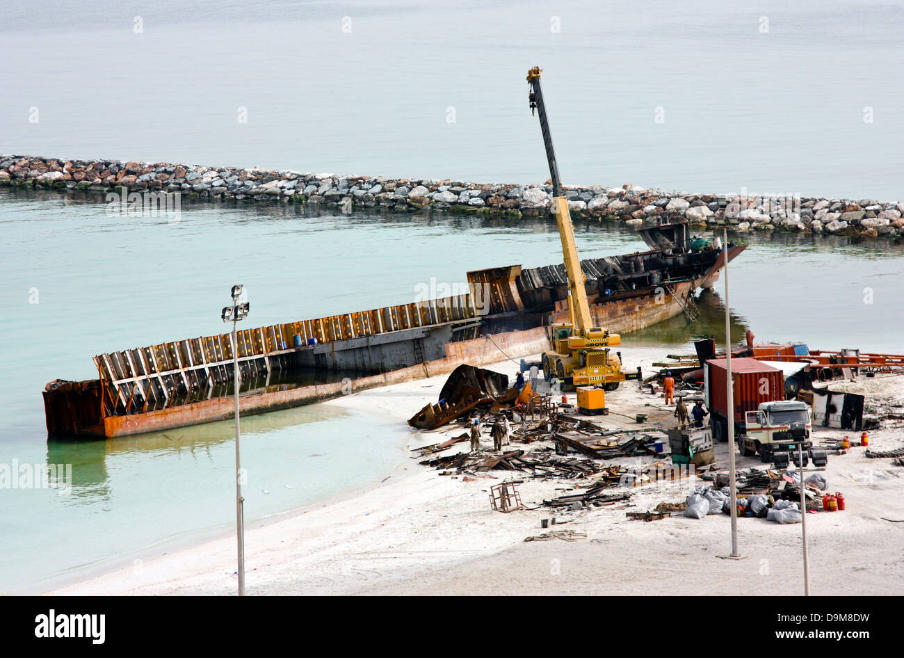 Ship breaking on the Beach, Coastal Freighter run aground in Ajman, United Arab Emirates Stock Photo