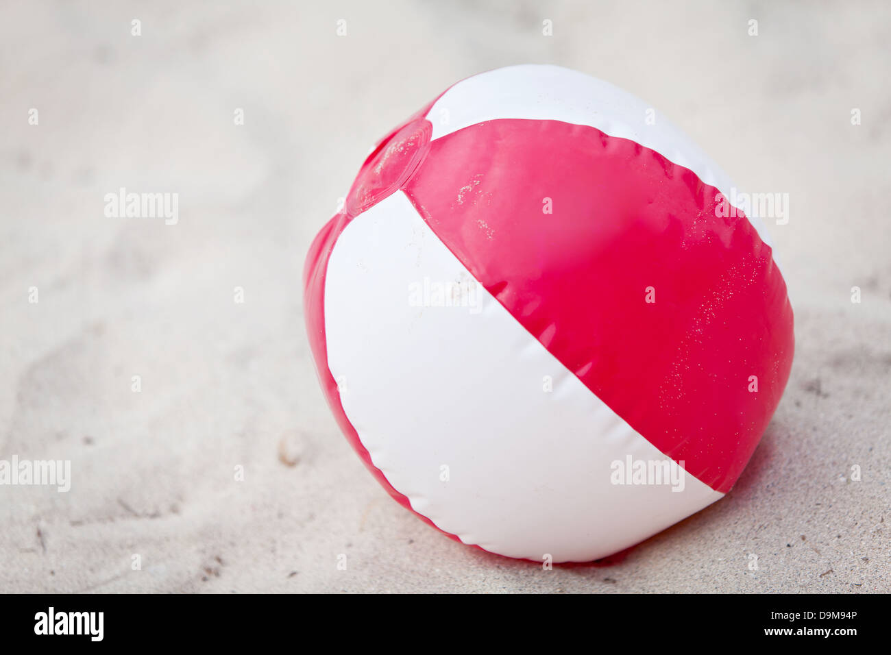 beach ball in sand on the beach summertime holiday vacation fun Stock