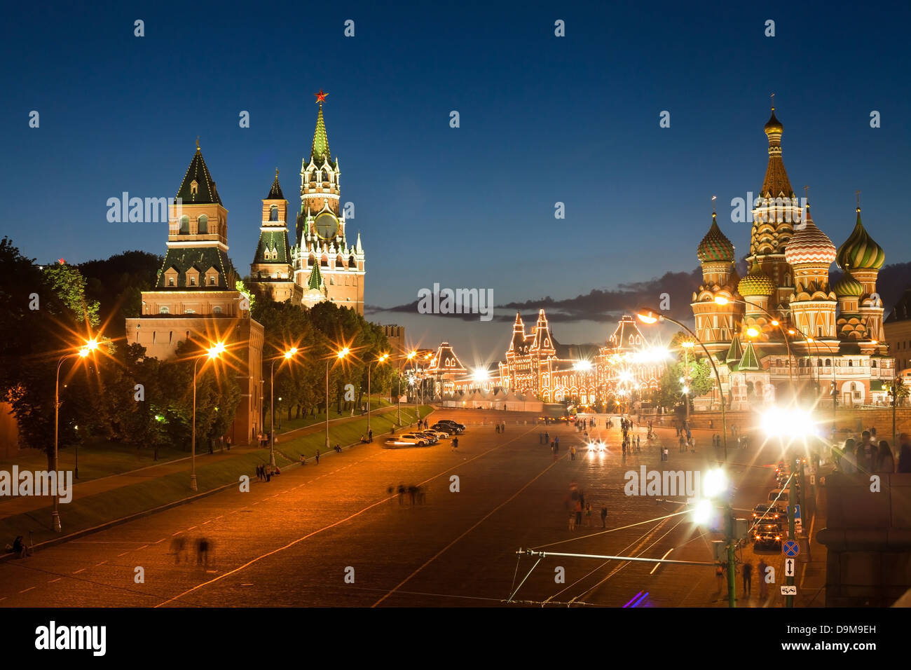 Red square and St. Basil cathedral at night, moving people around, long exposure Stock Photo