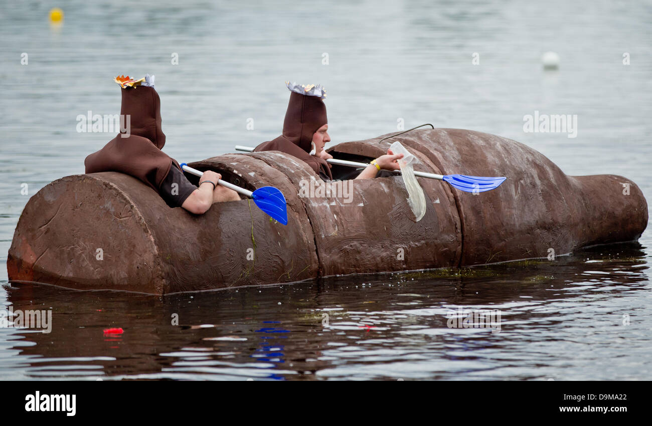 Nuremberg, Germany. 22nd June, 2013. Students of the Bundeswehr University Munich pour water out of their concrete boat 'Volle Pulle' during the 14th concrete canoe regatta in Nuremberg, Germany, 22 June 2013. About 1.000 participants, most of them students, built a canoe made of concrete and take part in a regatta on it. Photo: DANIEL KARMANN/dpa/Alamy Live News Stock Photo