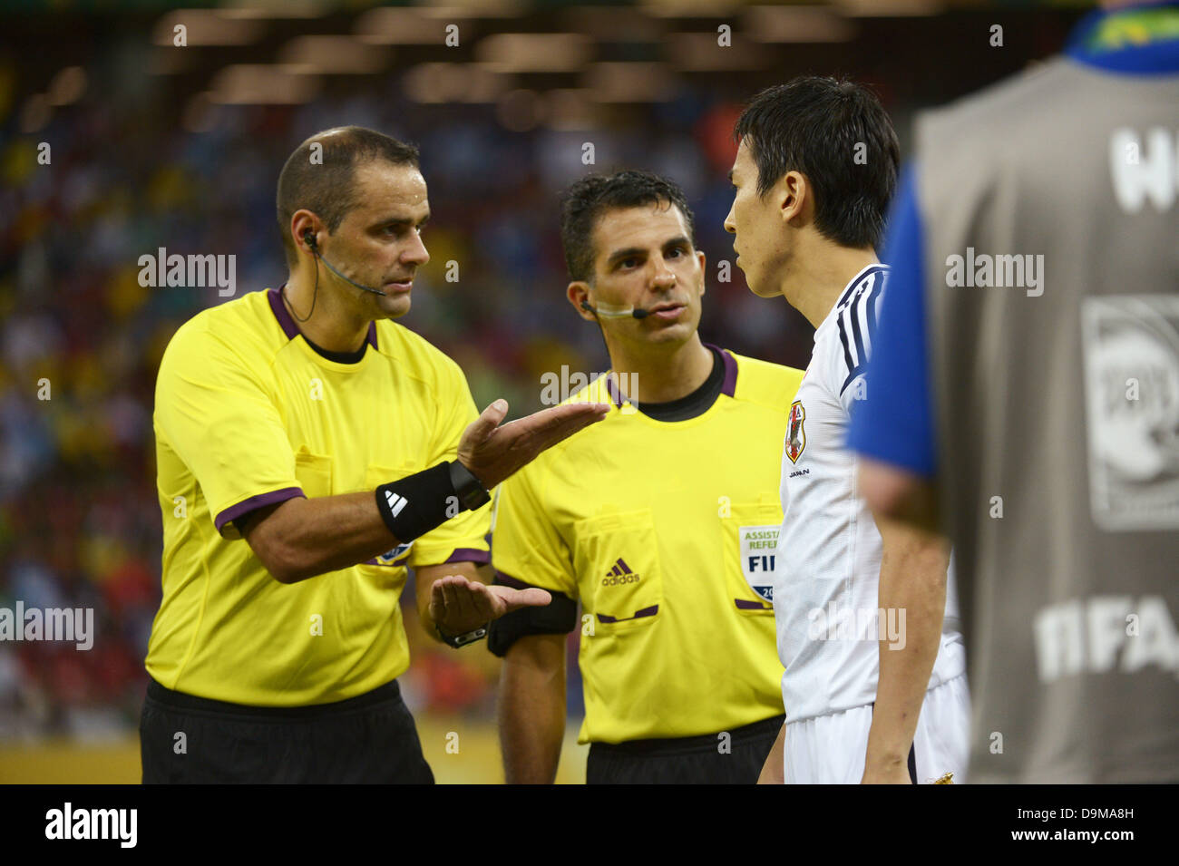 Recife, Brazil. 19th June, 2013. Diego Abal (Referee), Makoto Hasebe (JPN) Football / Soccer : Referee Diego Abal talks to Makoto Hasebe of Japan about the coin toss as assistant referee Hernan Maidana looks on before the FIFA Confederations Cup Brazil 2013 Group A match between Italy 4-3 Japan at Arena Pernambuco in Recife, Brazil . ©FAR EAST PRESS/AFLO/Alamy Live News Stock Photo