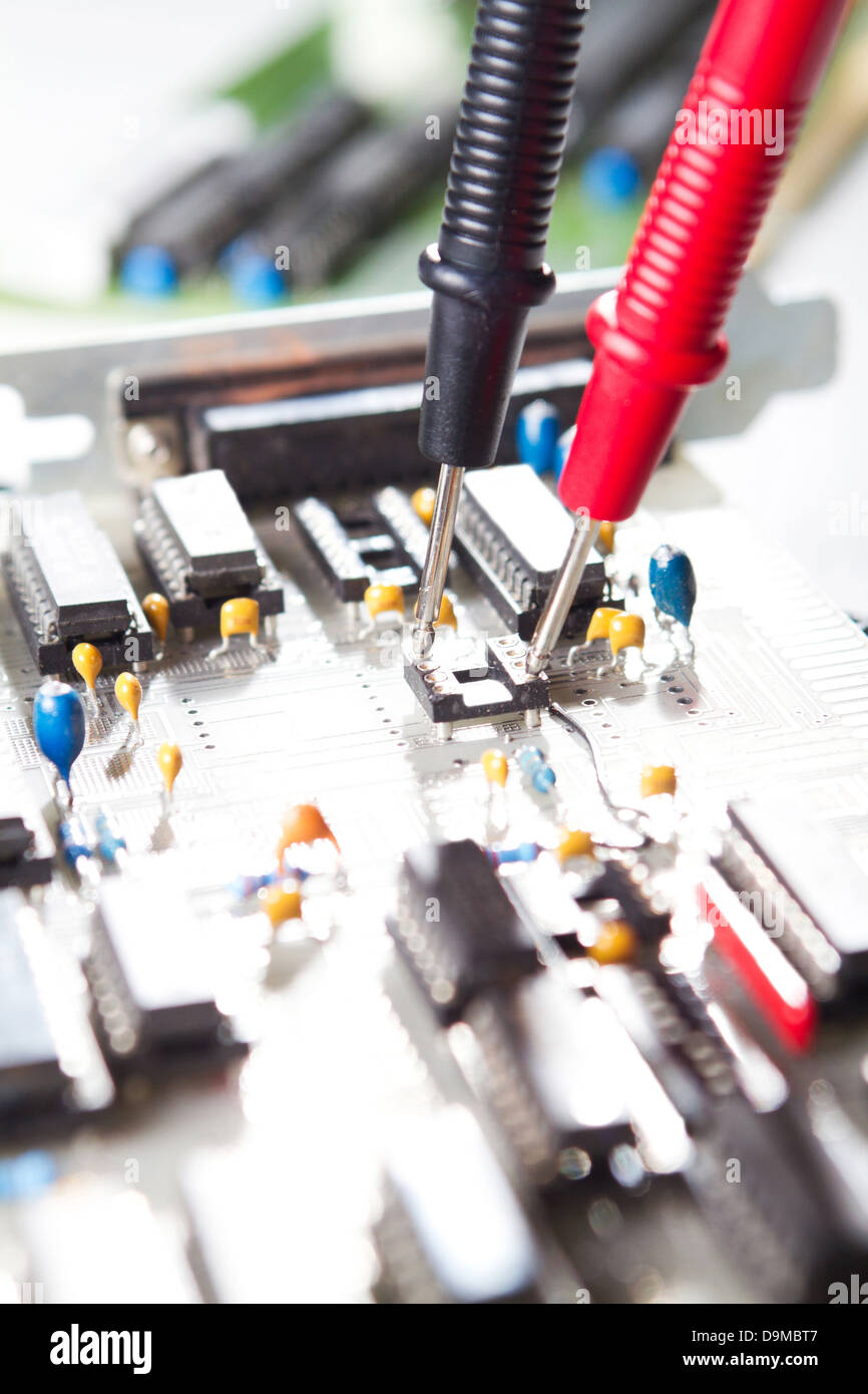 Multimeter examining a circuit board Stock Photo Alamy