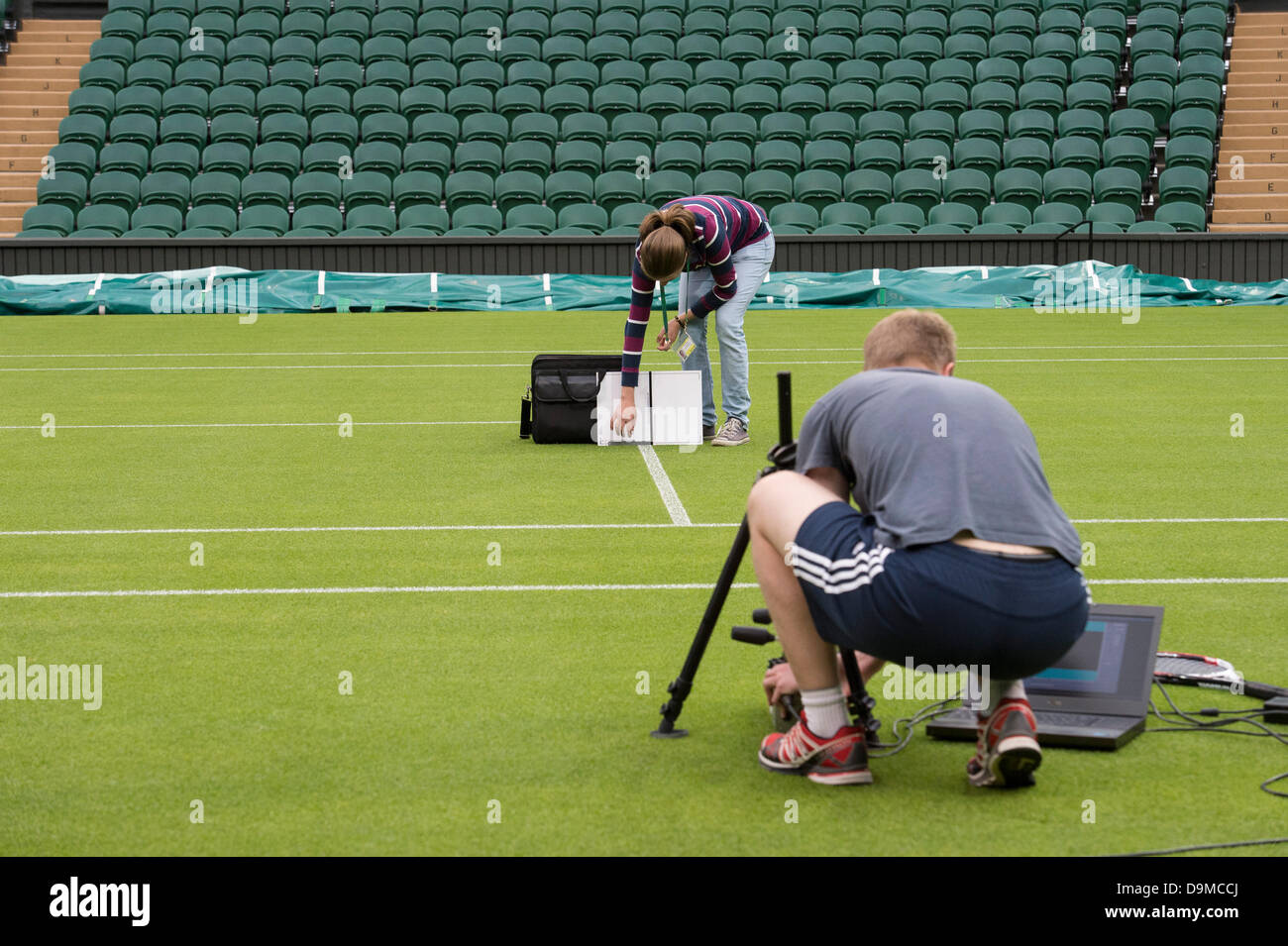 London, UK. 22nd June 2013. Practice and preparations take place ahead of The Wimbledon Tennis Championships 2013 held at The All England Lawn Tennis and Croquet Club.  General View (GV).  Hawkeye technicians make final adjustments to their system on Centre Court Credit:  Duncan Grove/Alamy Live News Stock Photo