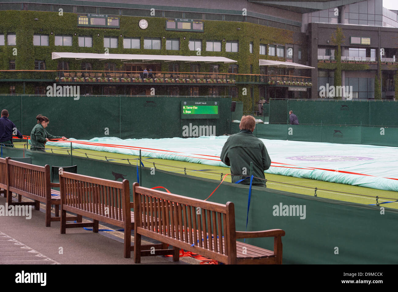 London, UK. 22nd June 2013. Practice and preparations take place ahead of The Wimbledon Tennis Championships 2013 held at The All England Lawn Tennis and Croquet Club.   General View (GV).Rain halts practice. Credit:  Duncan Grove/Alamy Live News Stock Photo