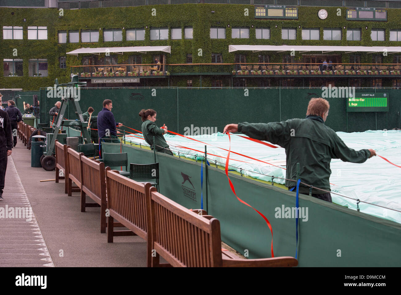 London, UK. 22nd June 2013. Practice and preparations take place ahead of The Wimbledon Tennis Championships 2013 held at The All England Lawn Tennis and Croquet Club.   General View (GV).Rain halts practice. Credit:  Duncan Grove/Alamy Live News Stock Photo