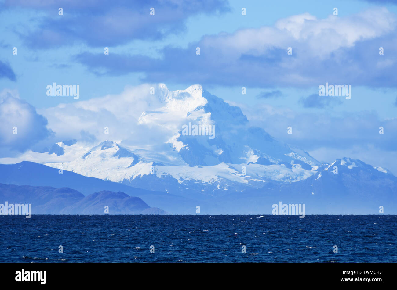 distant Mount Sarmiento looms above the Strait of Magellan in Patagonia Chile Stock Photo