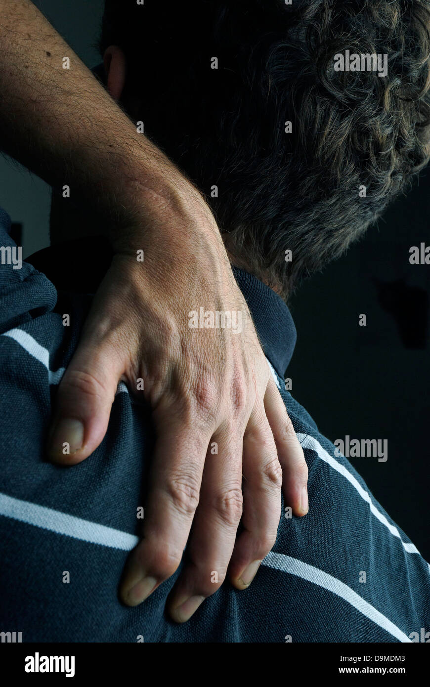 Man with back pain Stock Photo