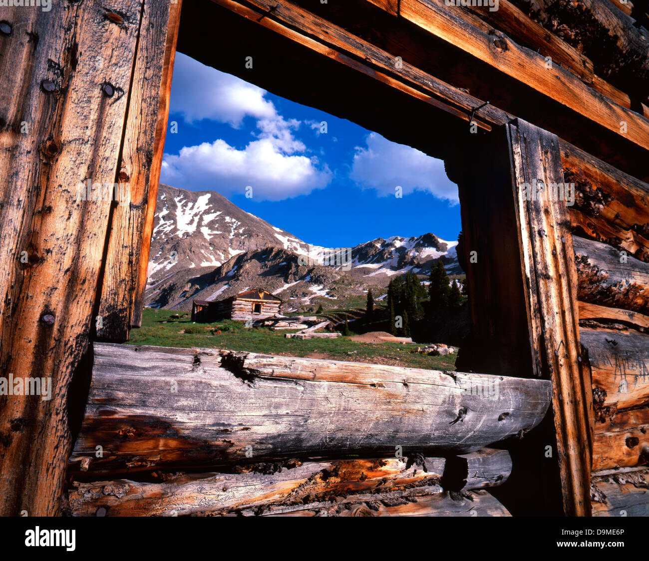 Colorado Rocky Mountains As Seen Through Pioneer Cabin In Back