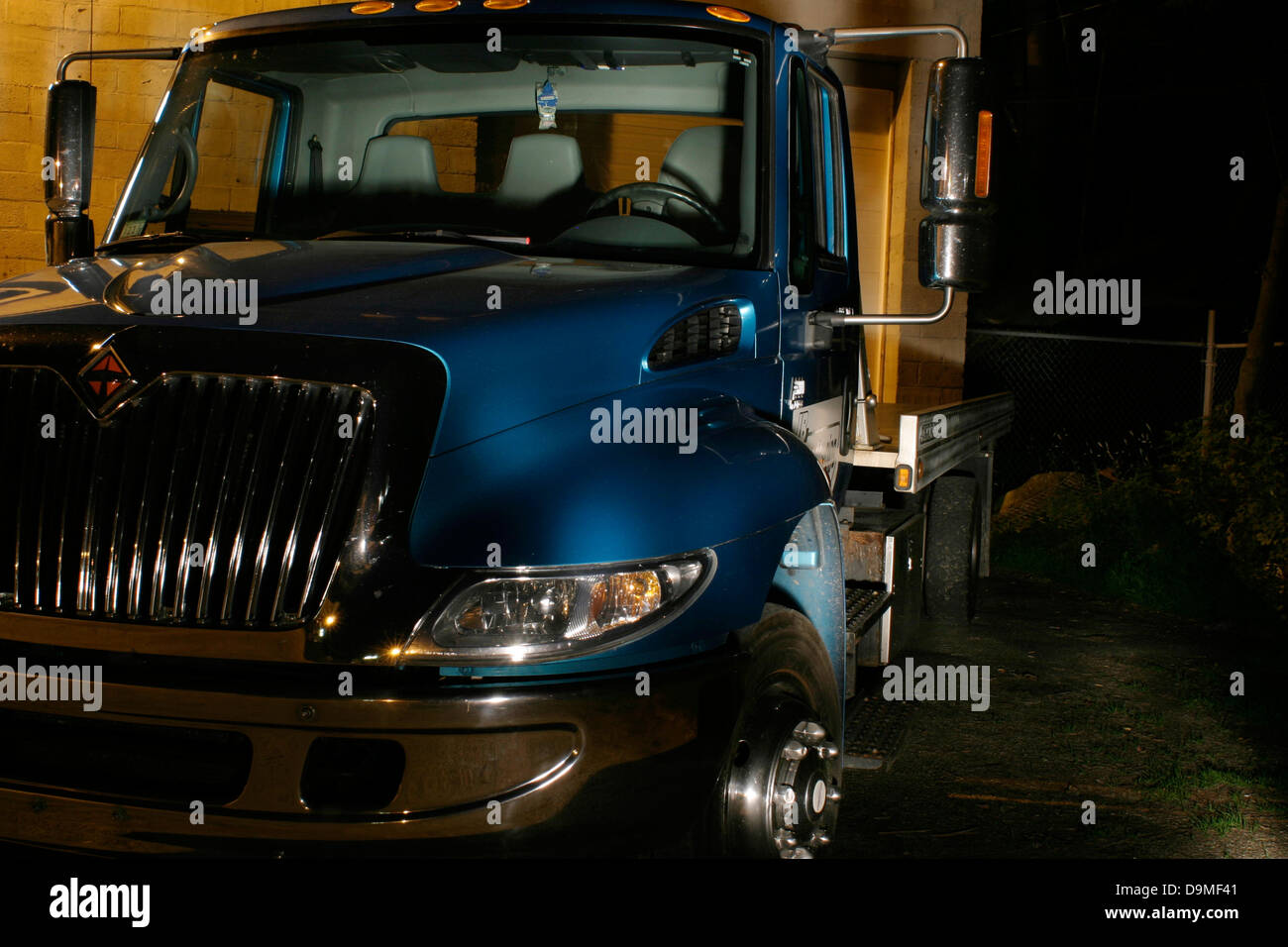 In Pittsfield Massachusetts a shiny tow truck waits at night for the