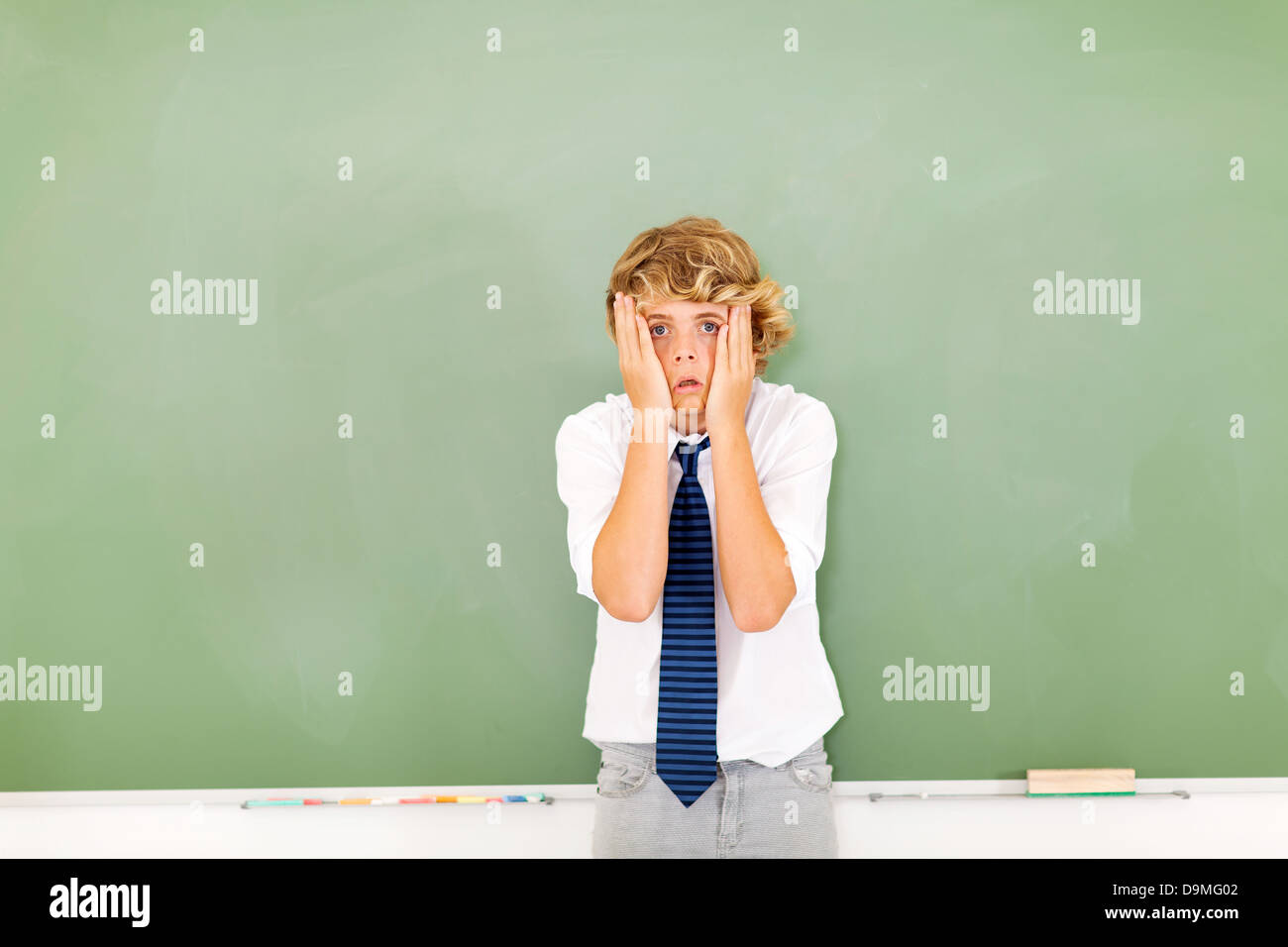 cute teenage boy feeling confused Stock Photo