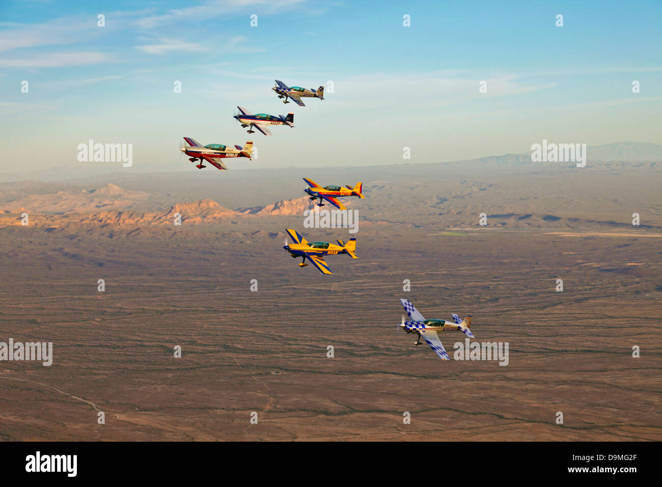 Extra 300 aerobatic aircraft fly in formation during APS training in Mesa, Arizona. Stock Photo