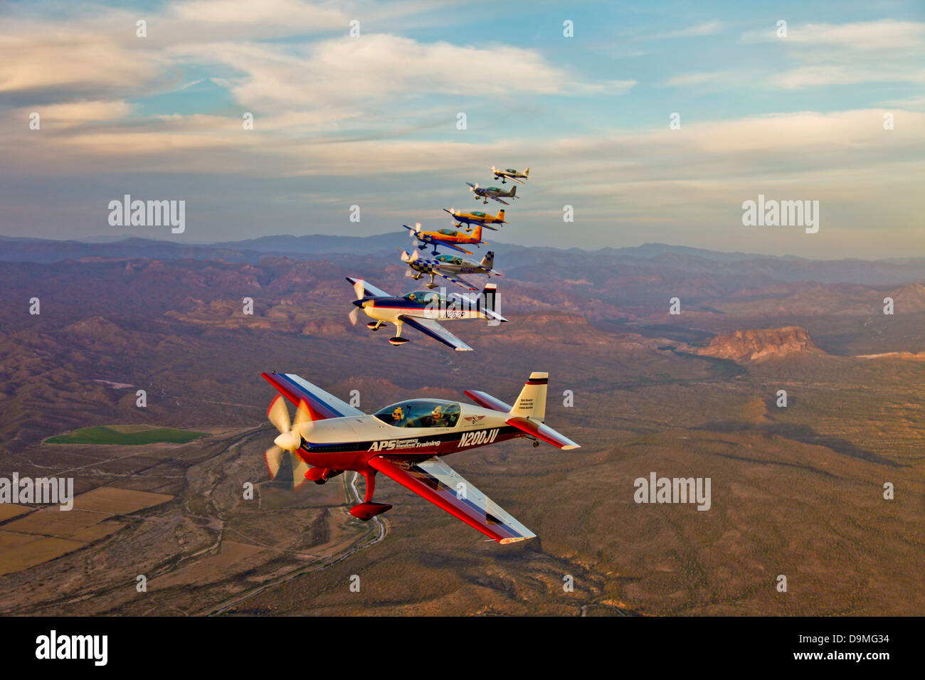 Extra 300 aerobatic aircraft fly in formation during APS training in Mesa, Arizona. Stock Photo
