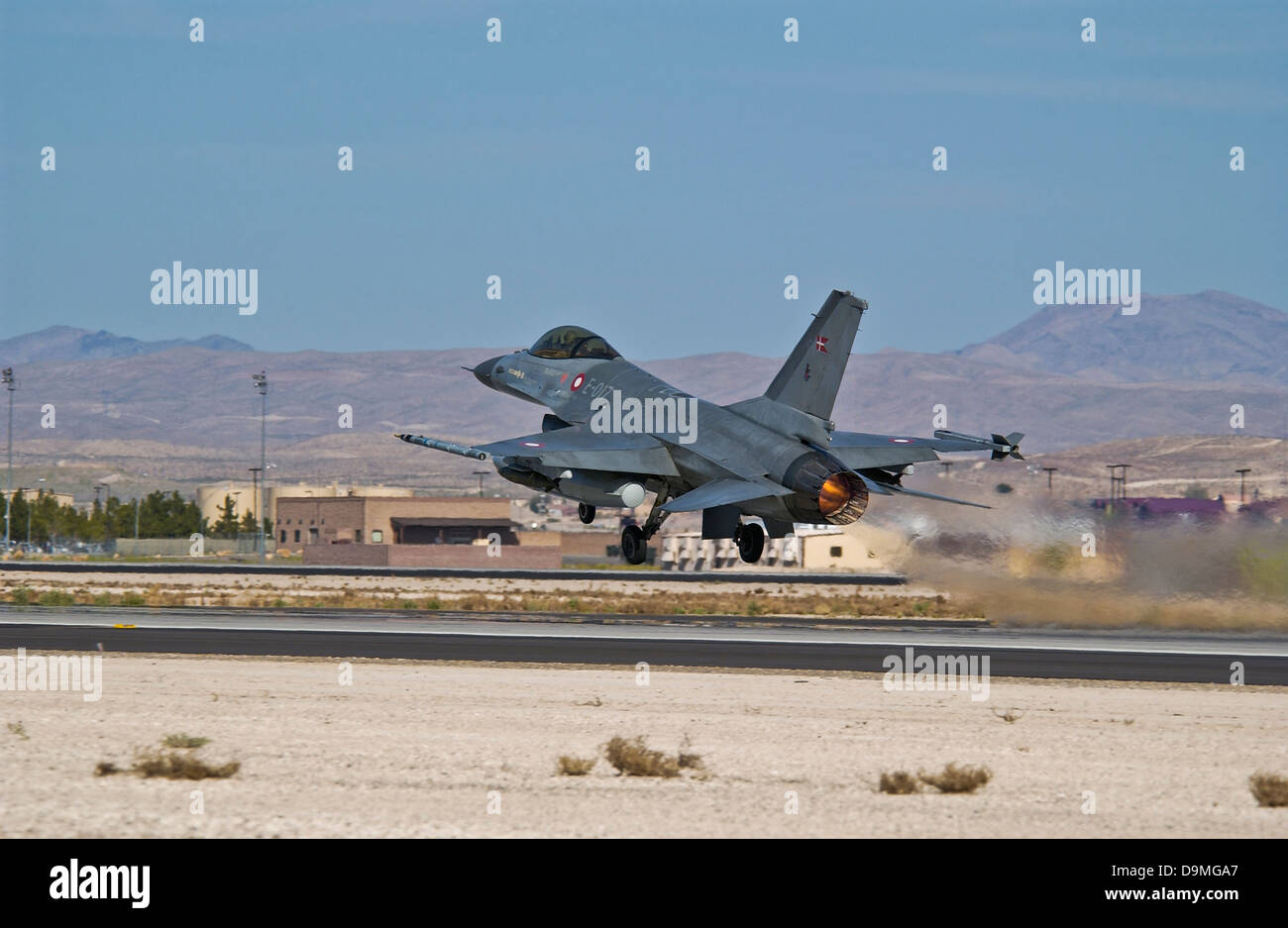An F-16A Fighting Falcon of the Royal Danish Air Force taking off from Nellis Air Force Base, Nevada. Stock Photo