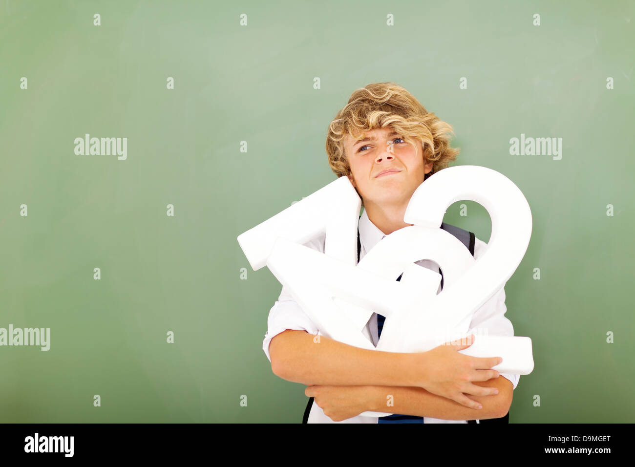 young male high school student thinking about mathematics subject Stock Photo