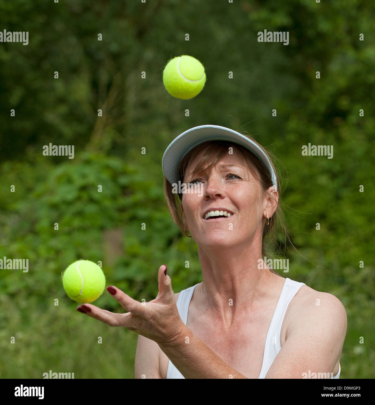 Mature woman playing tennis hires stock photography and images Alamy