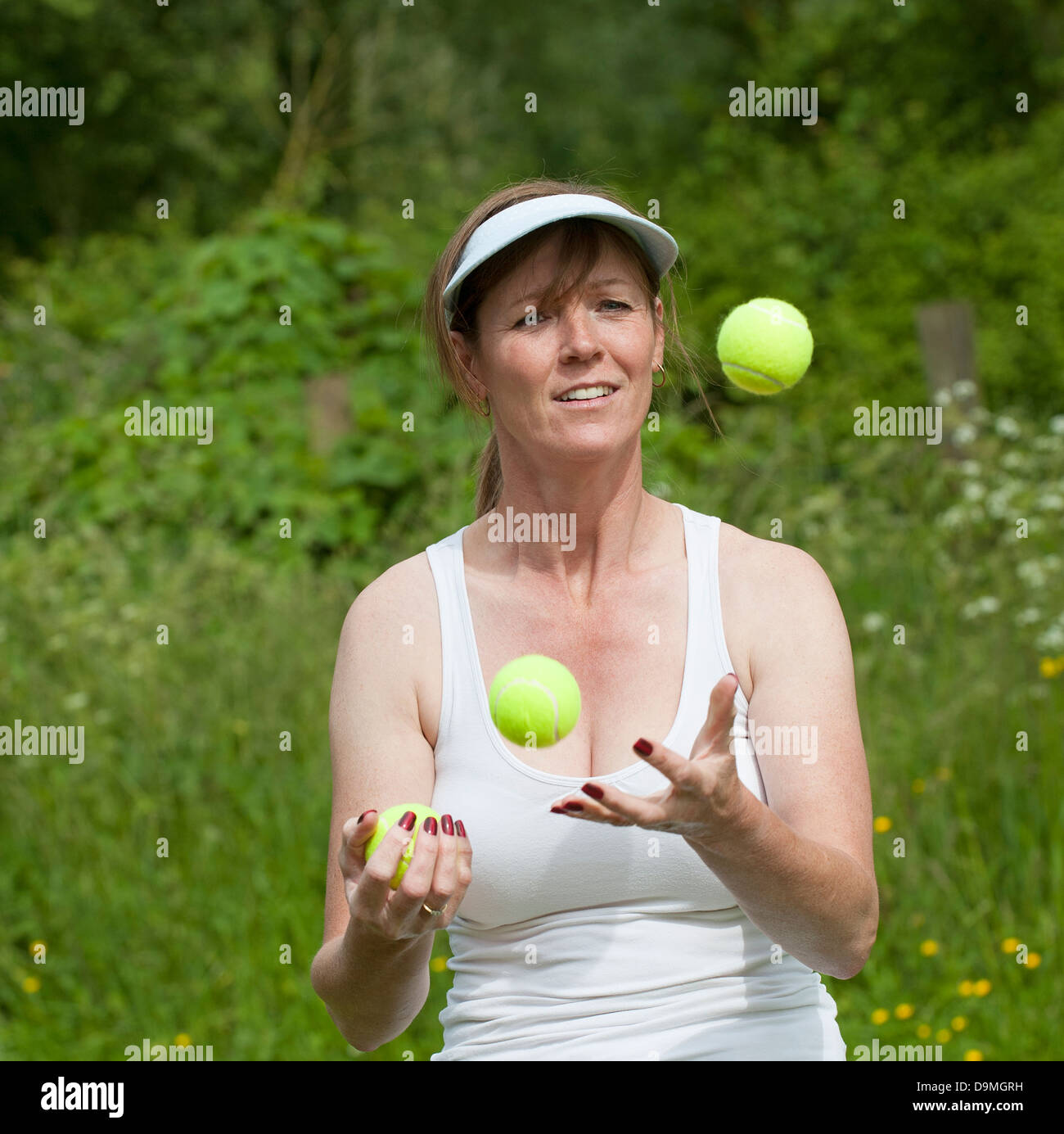 Woman juggling balls hires stock photography and images Alamy