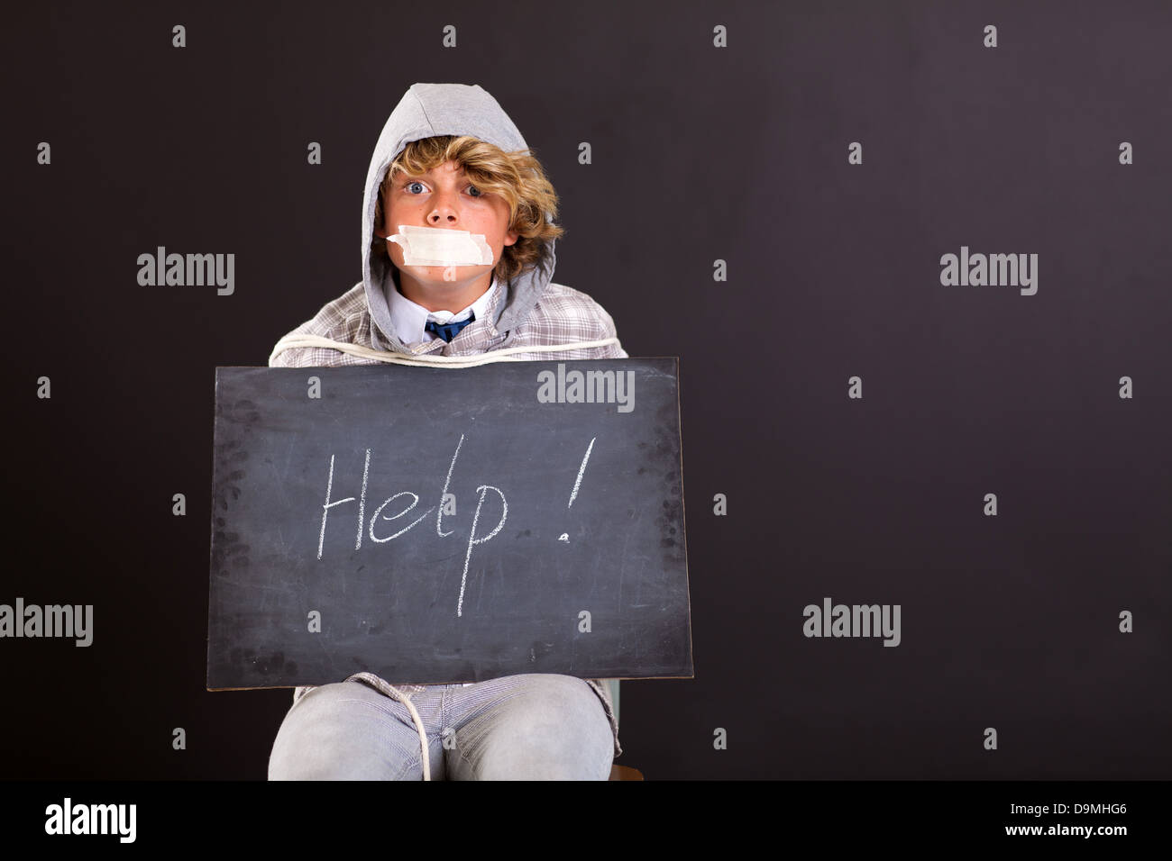 teen boy been kidnapped and crying for help Stock Photo