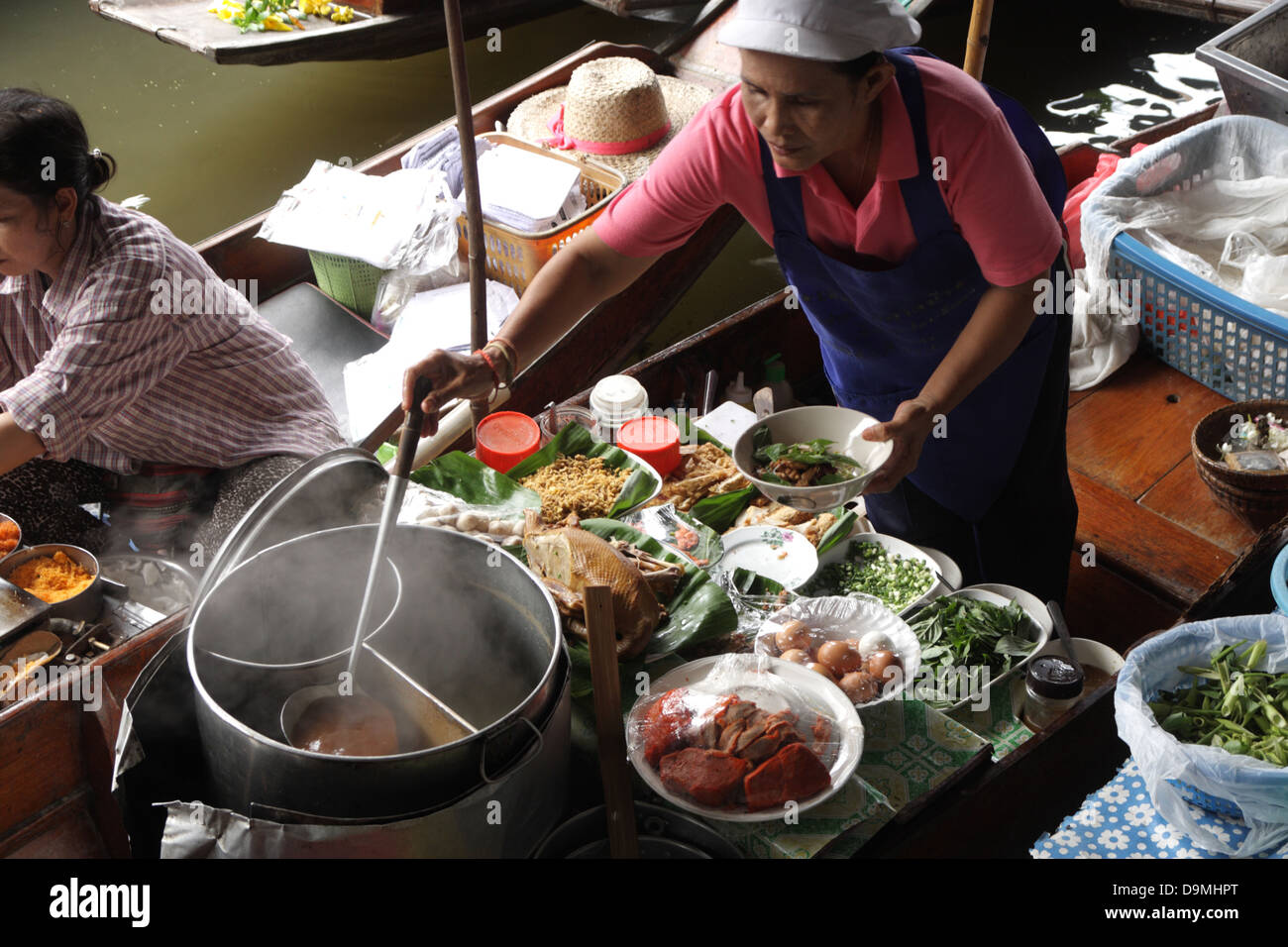 Thai Merchant Preparing Boat Noodle On Boat Damnoen Saduak Floating