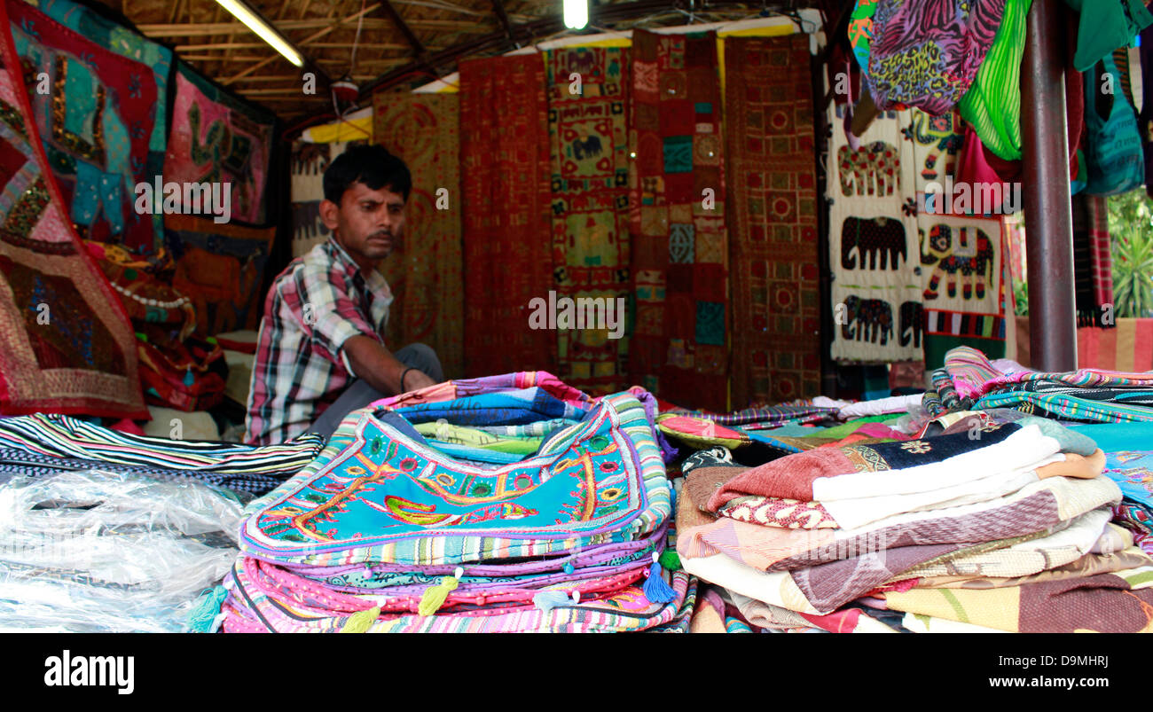Shops displayng ethnic dresses, jewelery and souvenirs at the Delhi Haat Stock Photo