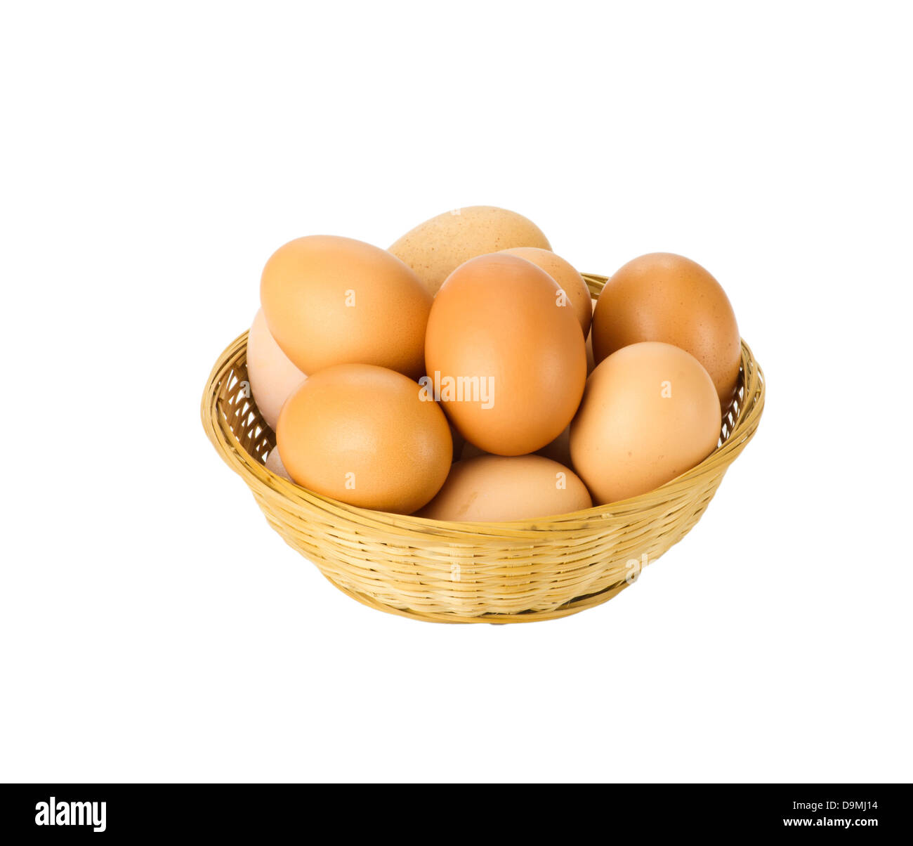 Fresh brown eggs in wicker basket isolated on white Stock Photo