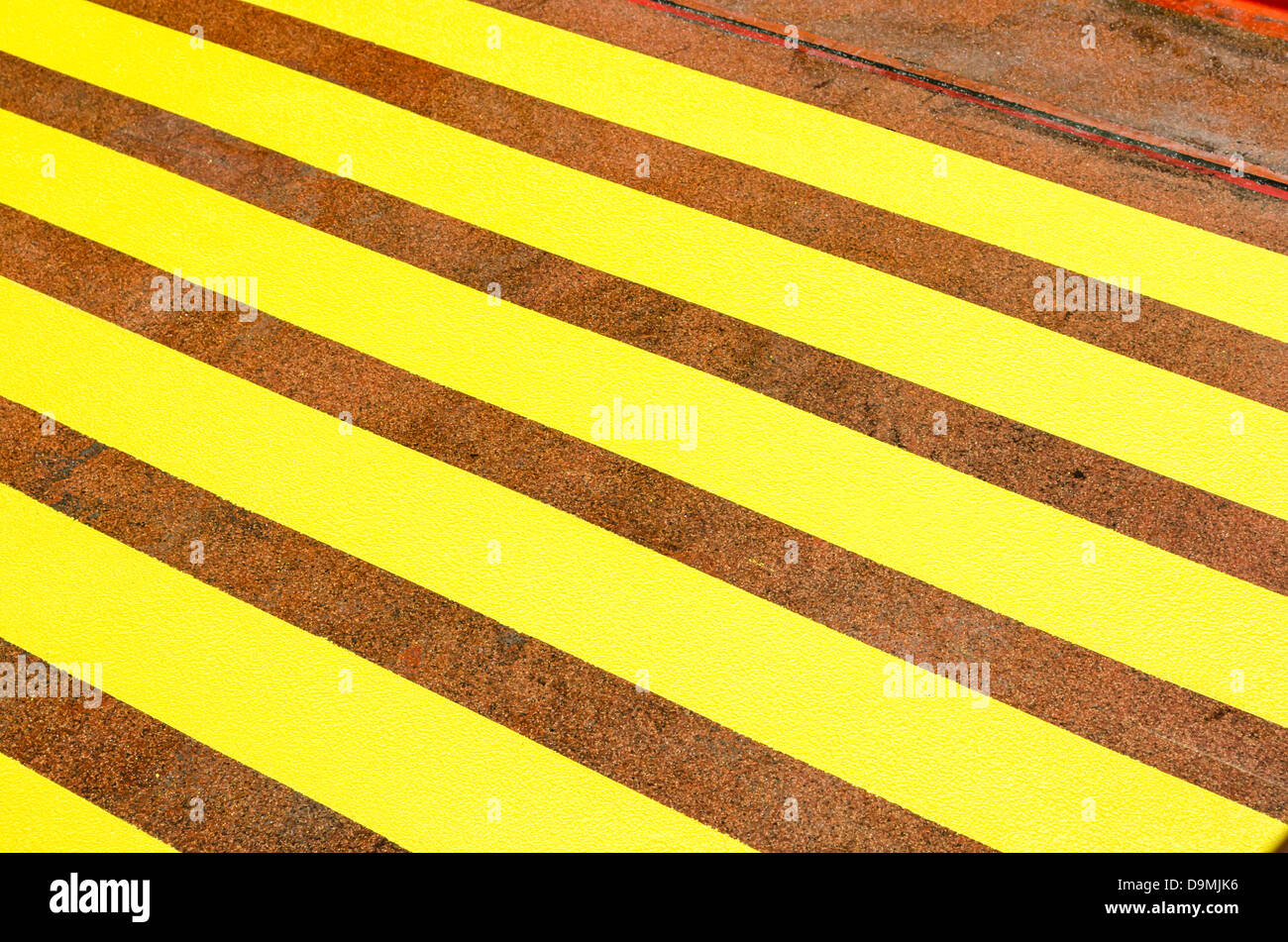 Yellow striped floor pattern outside Amsterdam Centraal. Amsterdam, NL. Stock Photo