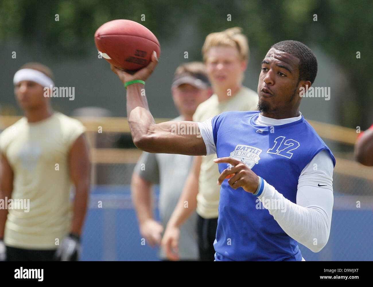 June 22, 2013 - Tampa, Florida, U.S. - DANIEL WALLACE   |   Times.Armwood quarterback Noah Johnson (12) makes a pass against Plant during the inaugural Battle of the Bay 7-on-7 football tournament at Jefferson High School, sponsored by HomeTeam, on Saturday, June 22. (Credit Image: © Daniel Wallace/Tampa Bay Times/ZUMAPRESS.com) Stock Photo