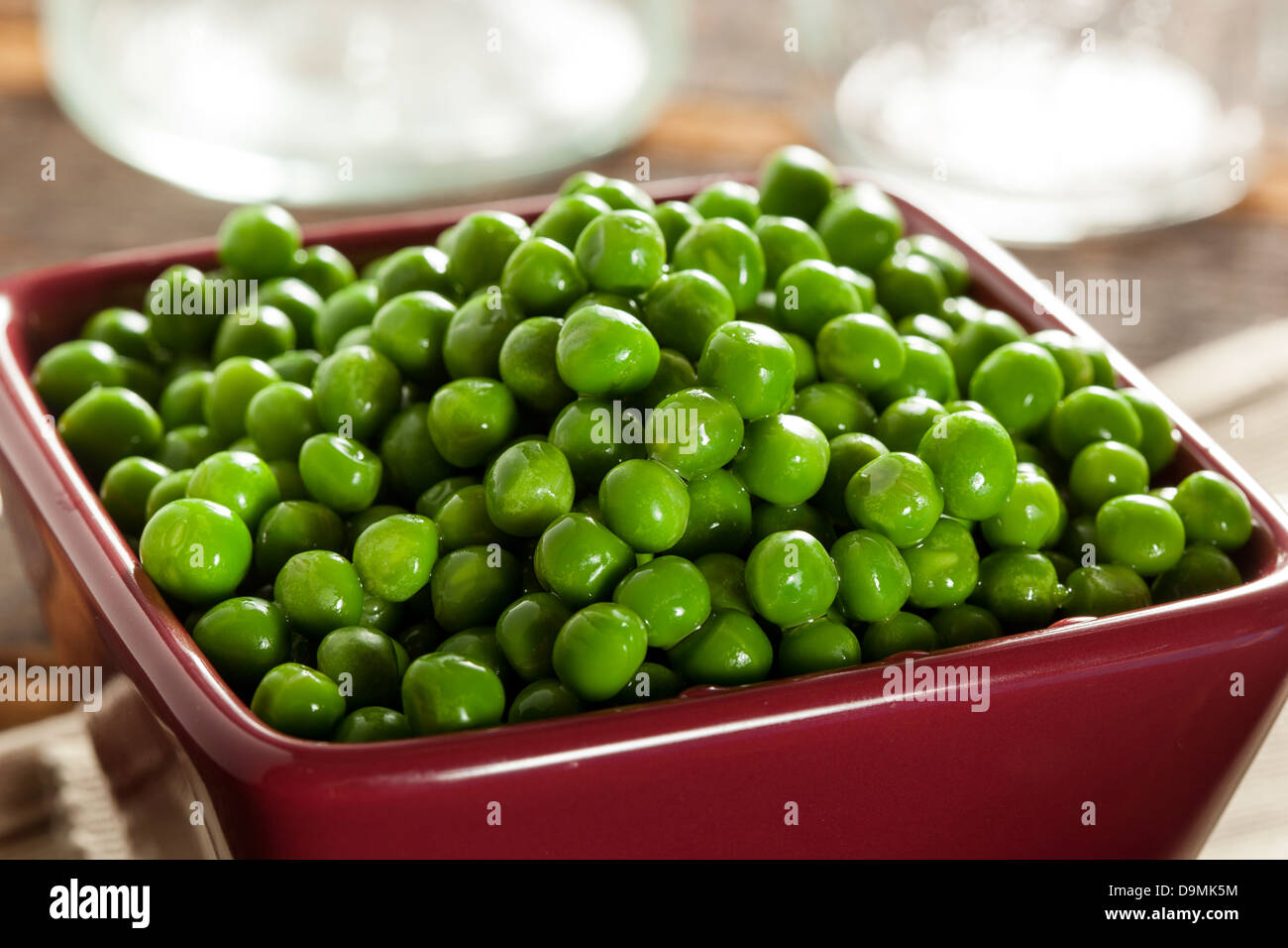 Fresh Green Organic Cooked peas against a background Stock Photo