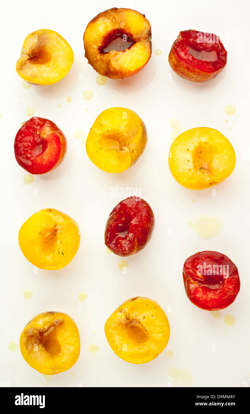 Cut peaches on white background Stock Photo