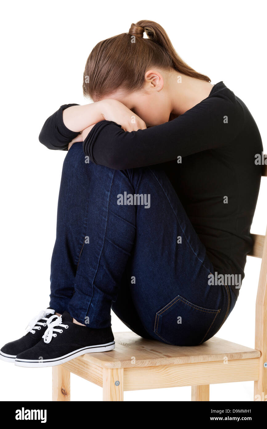 Sad teen girl heaving depression. Isolated on white Stock Photo - Alamy