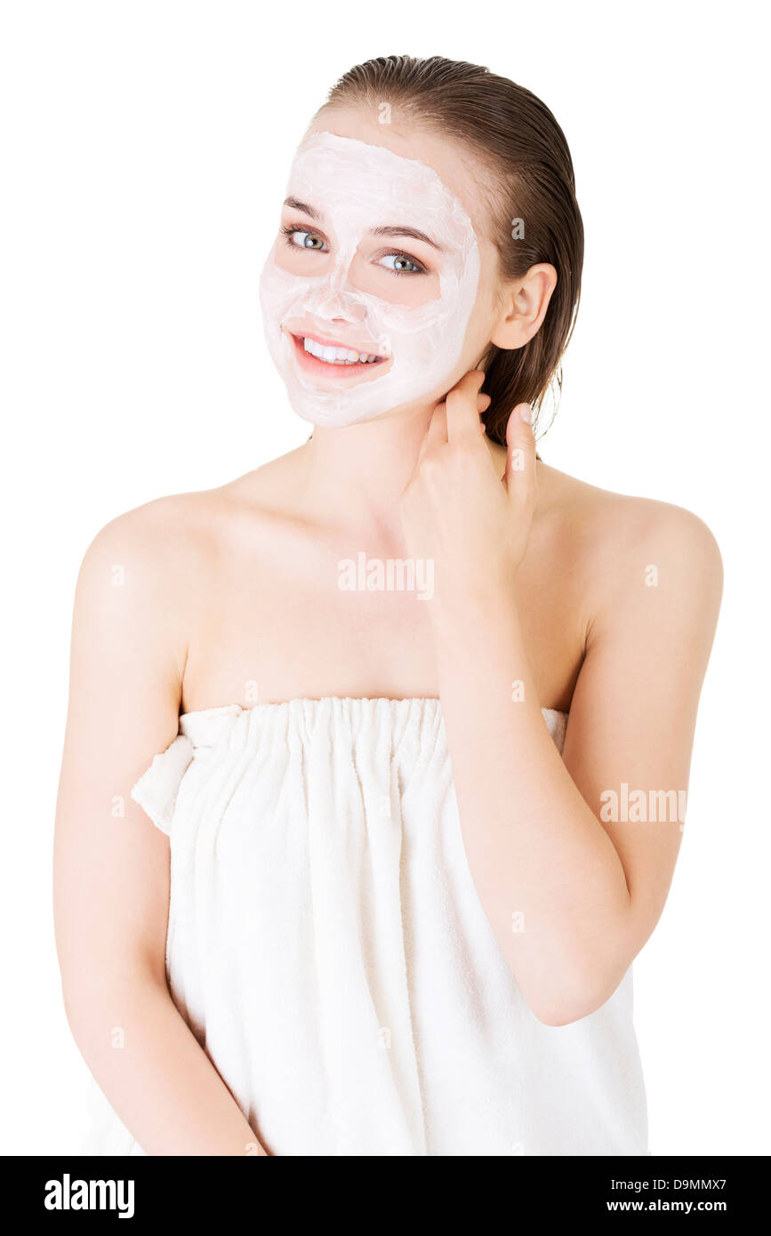 Beautiful woman with clay facial mask, isolated on white Stock Photo ...