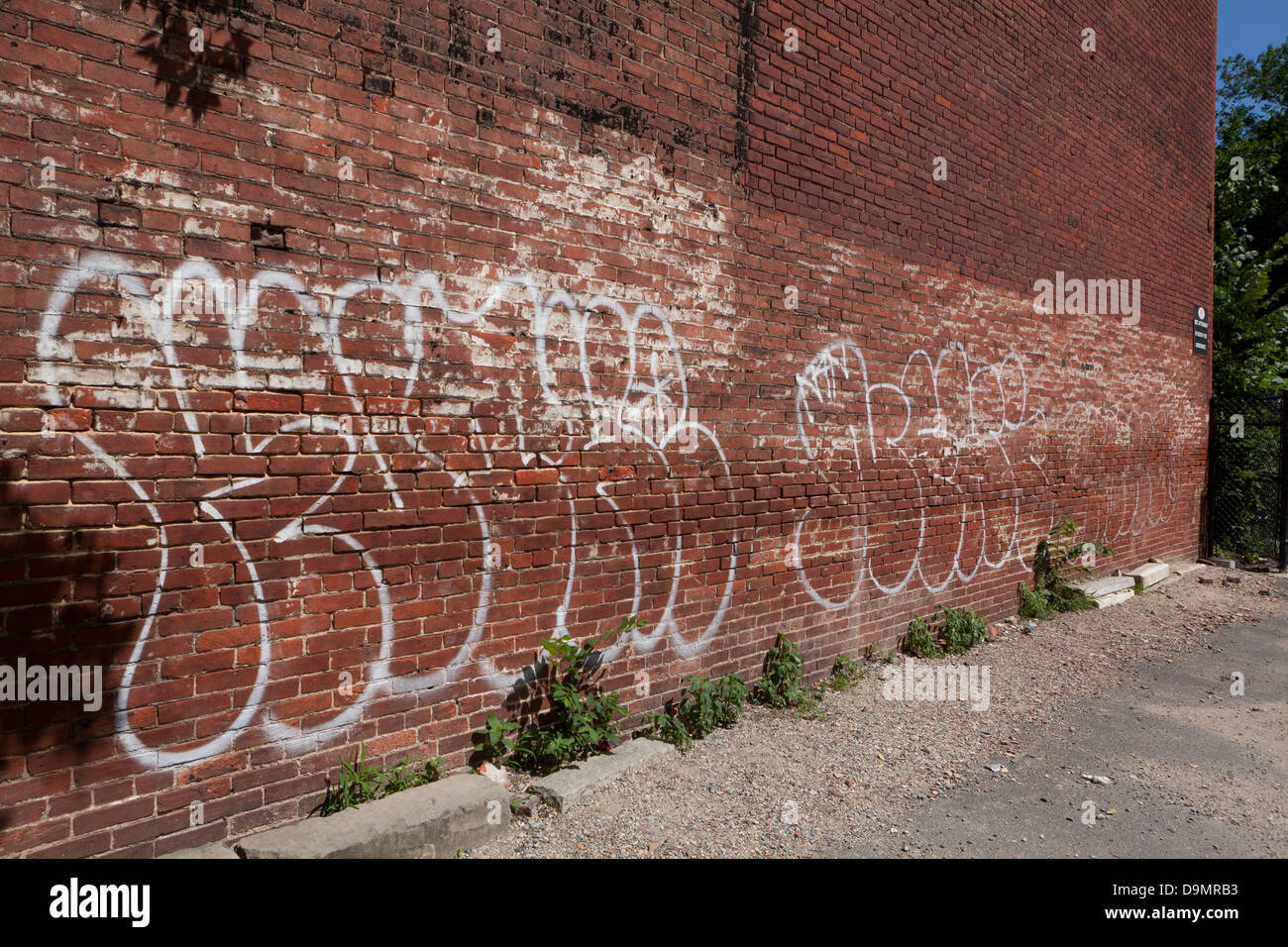 Graffiti on side of brick building - USA Stock Photo